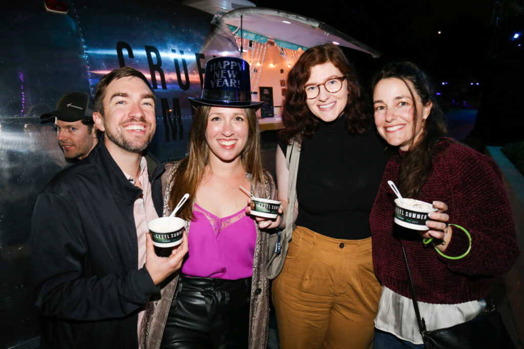 Spirit 66, Coachella Party versatile Vintage Airstream at Cruel Summer Season 2 Opening party by Hulu at Grace E Simmons Lodge in Los Angeles, CA. Pictured are guests enjoying their ice cream they just picked up from the Airstream service window.